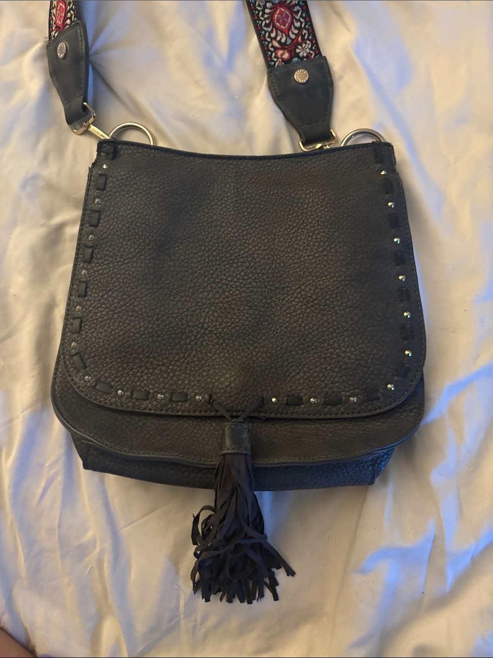 Steve Madden Black Textured Crossbody with Tassel and Patterned Strap